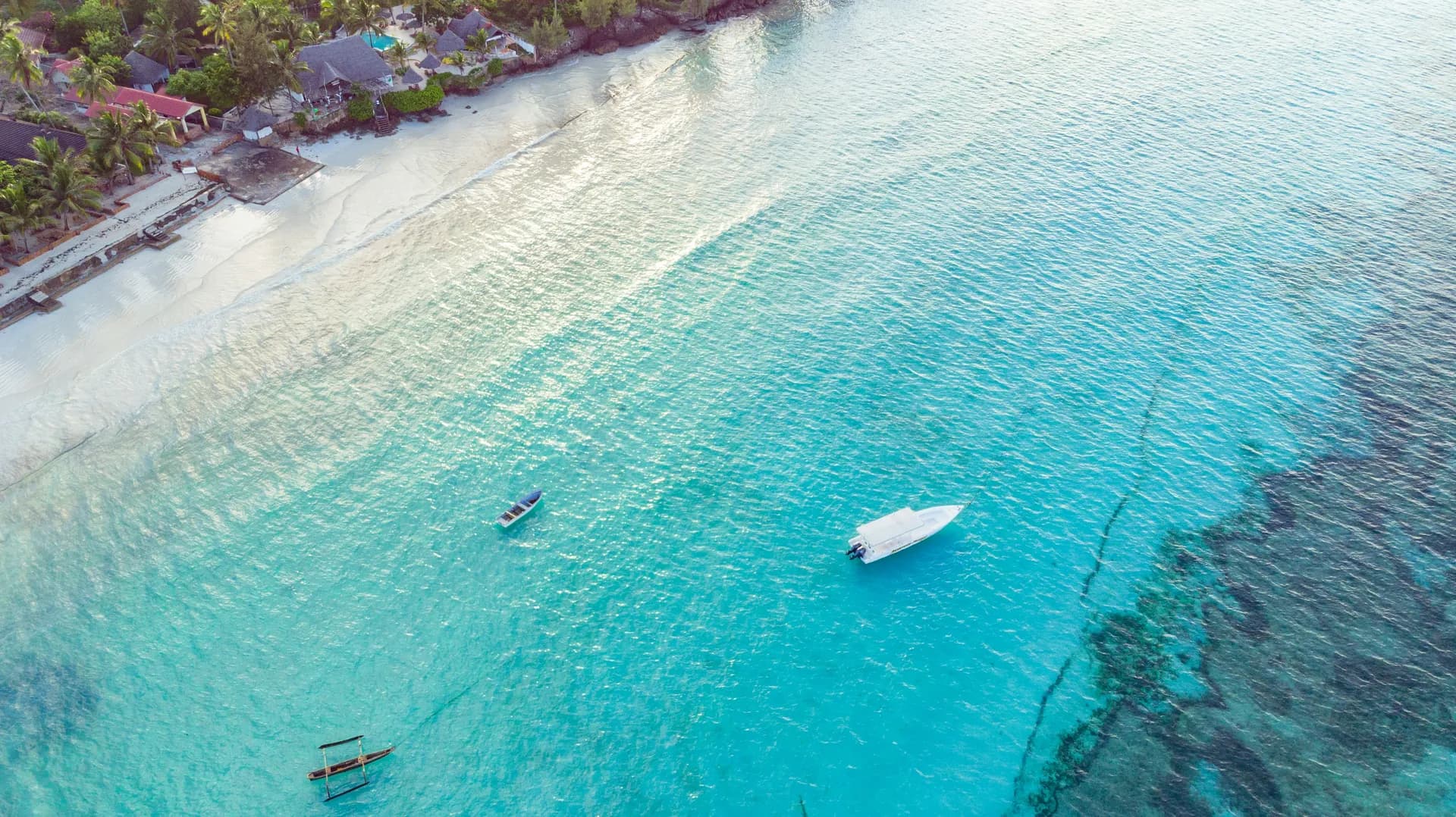 Turquoise shallows and white sand on the Zanzibar coast.